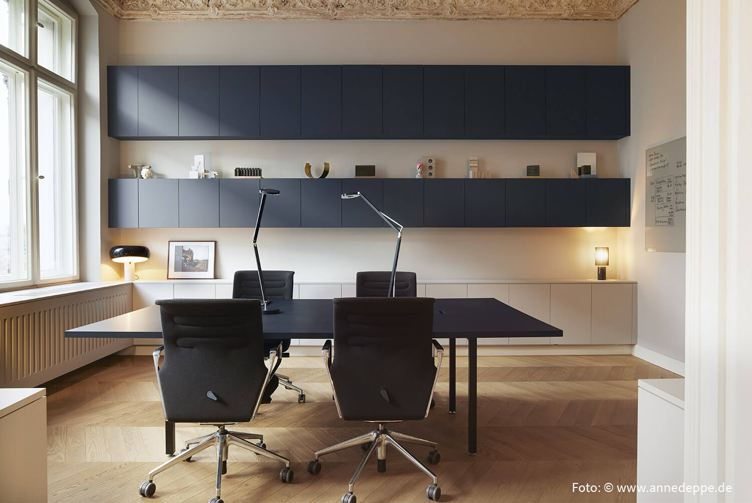 Floorboard laid as herringbone in showroom in Berlin