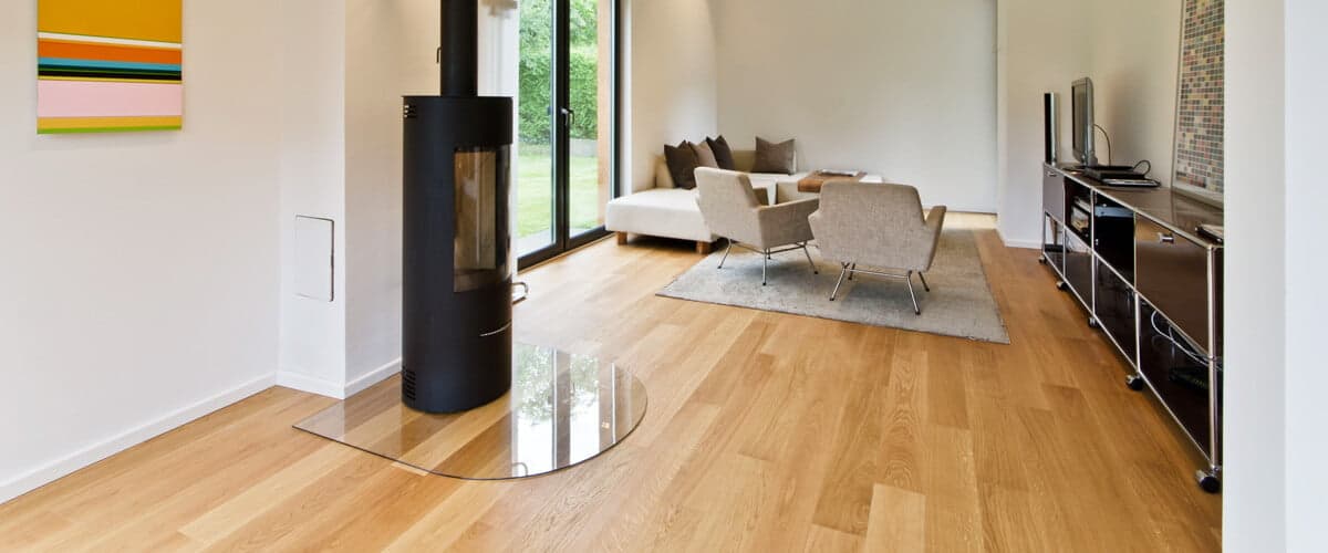 Floorboards laid in living room with fireplace