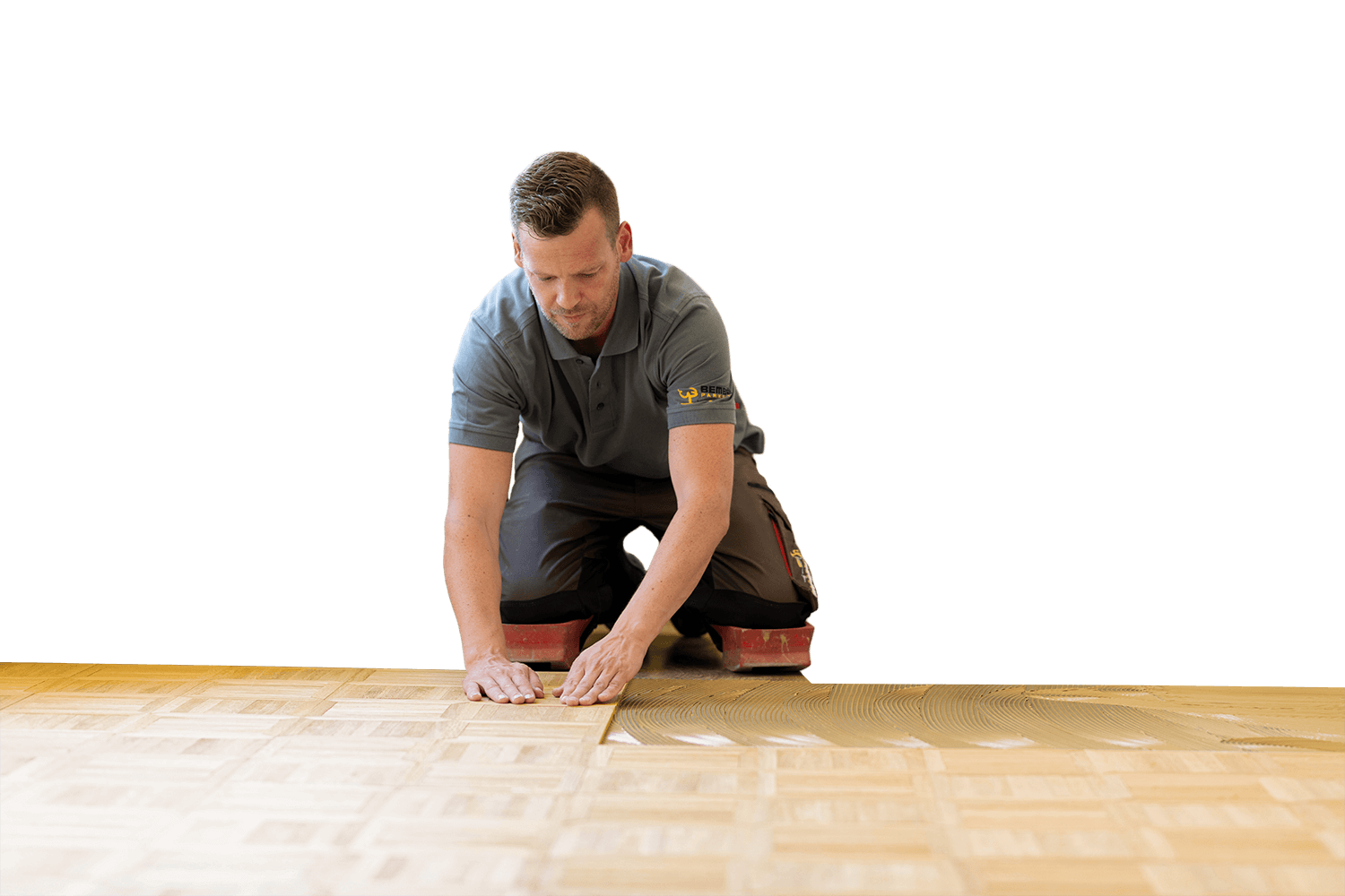 Parkettleger verlegt Parkettboden